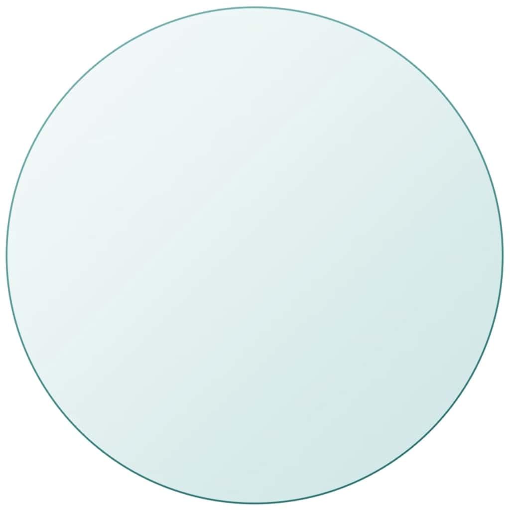 Plateau rond transparent en verre trempé posé sur un support sobre dans un intérieur lumineux
