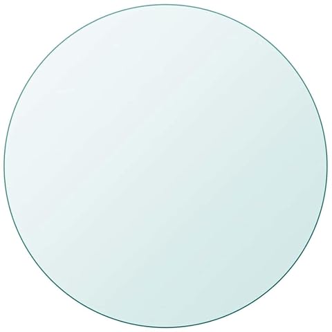 Plateau rond transparent en verre trempé posé sur un support sobre dans un intérieur lumineux