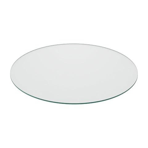 Plaque ronde transparente en verre trempé posée sur une table en bois naturel.