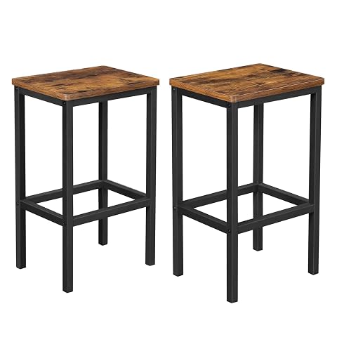 Deux tabourets de bar marron rustique et noir, avec structure en acier et repose-pieds