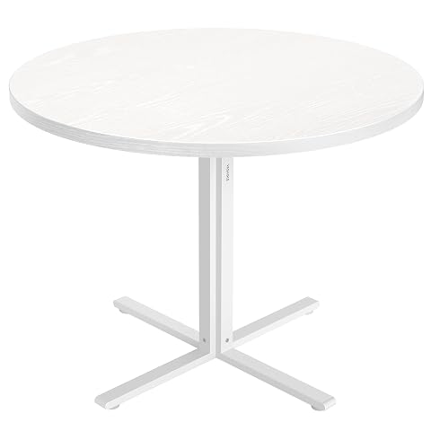 Table à manger ronde Vasagle blanche avec piètement en acier dans un intérieur lumineux