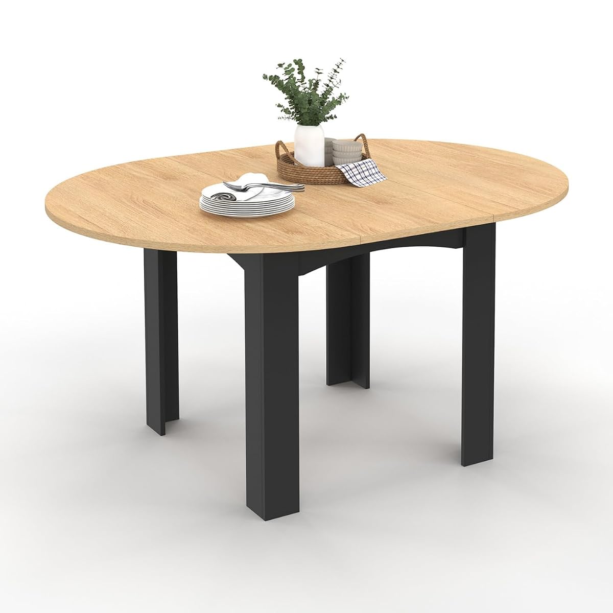 Table ronde extensible Dona, plateau façon hêtre et pieds noirs dans une salle à manger lumineuse.