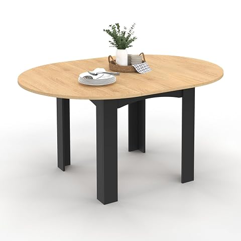 Table ronde extensible Dona, plateau façon hêtre et pieds noirs dans une salle à manger lumineuse.