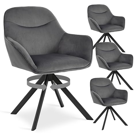Quatre chaises pivotantes en velours gris foncé avec accoudoirs autour d’une table ronde