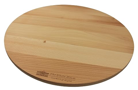 Plateau tournant rond en bois de hêtre brun présenté sur une table avec une pizza